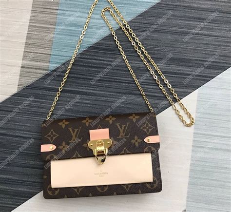 louis vuitton twist chain wallet|louis vuitton vavin chain wallet.